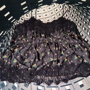 TOPSHOP silk & laced top. Black in color with multicolored flowers all over.